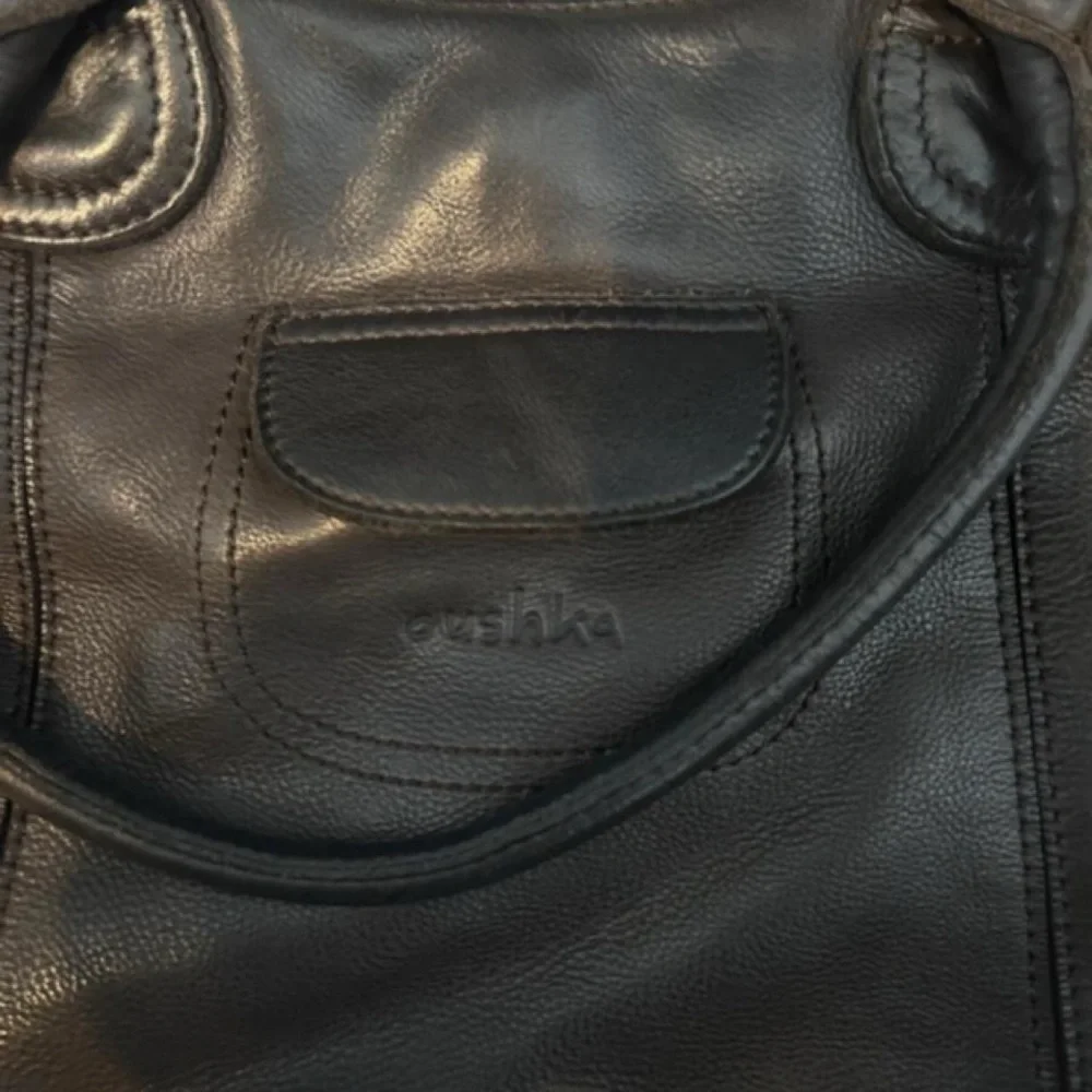 Oushka Dark Brown Slouchy, Utilitarian-style Shoulder bag.